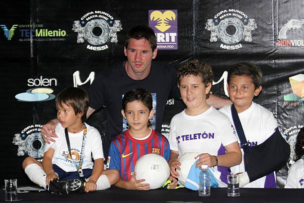 Argentine soccer player Lionel Messi poses for a picture during a press conference before a benefit match for disabled children on June 16, 2012 in...