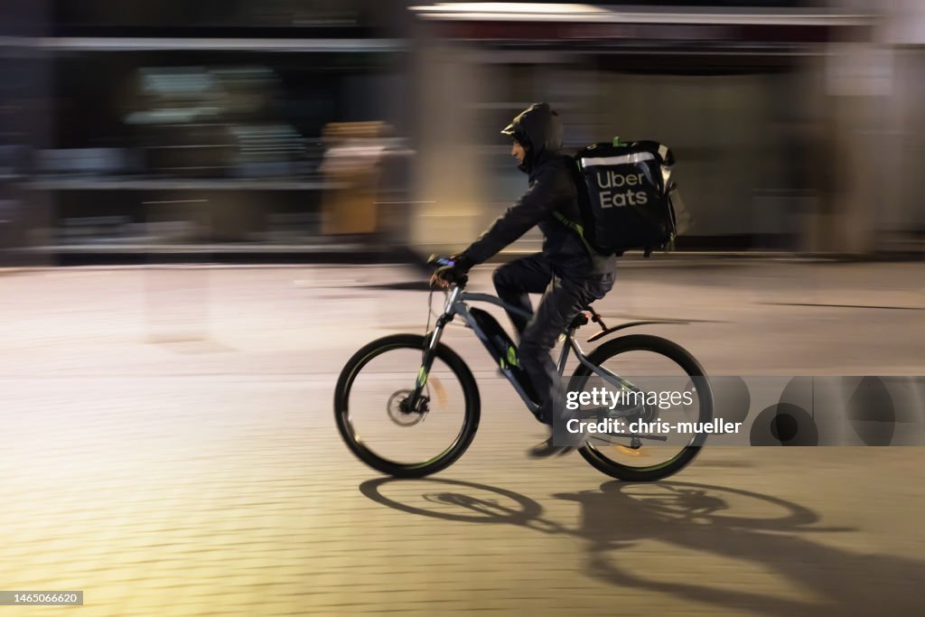 Man delivering food on a bike for Uber Eats