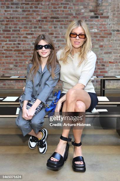 Marlowe Sturridge and Sienna Miller attend the Proenza Schouler show during New York Fashion Week: The Shows at Chelsea Factory on February 11, 2023...