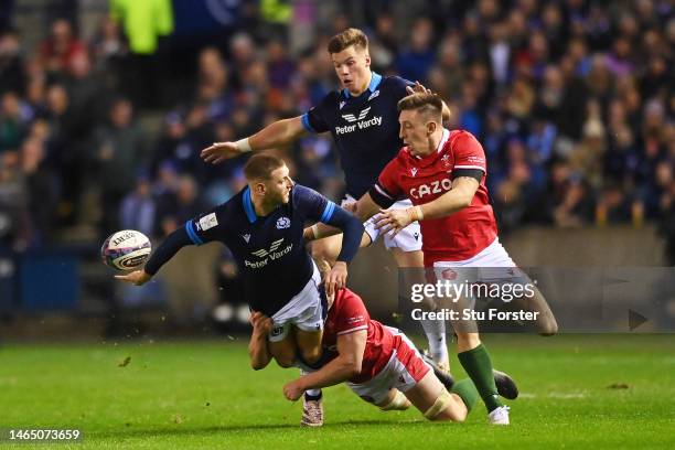 Finn Russell of Scotland passes the ball out the back of his hand during the Six Nations Rugby match between Scotland and Wales at Murrayfield...