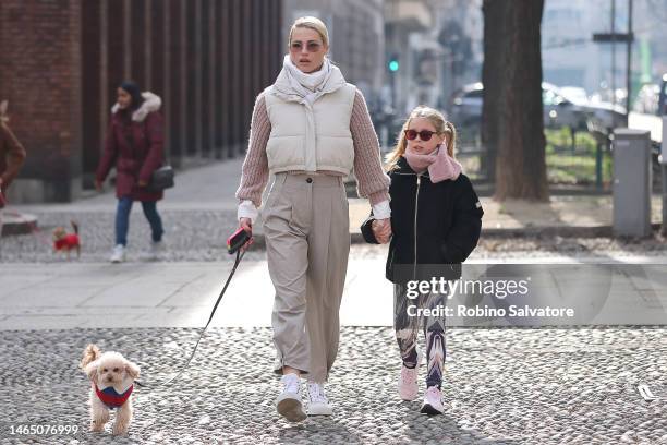 Michelle Hunziker is seen with daughters Aurora Ramazzotti, Sole Trussardi and Celeste Trussardi on February 11, 2023 in Milan, Italy.