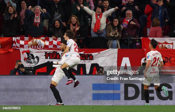 Yousseff En-Nesyri of Sevilla FC celebrates with teammate Bryan Gil after scoring the team's first goal during the LaLiga Santander match between...