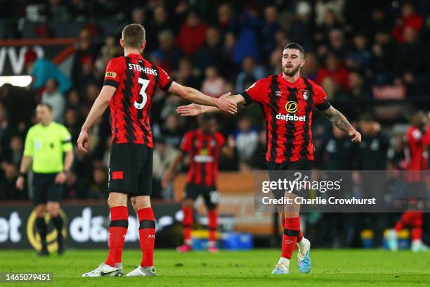 Marcos Senesi of AFC Bournemouth celebrates with team mate Jack Stephens after scoring their sides first goal during the Premier League match between...