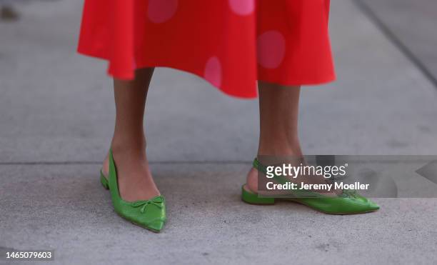 Olivia Joan seen wearing Kate Spade red long skirt with pink polka dot pattern, Kate Spate green leather mules before the Kate Spade presentation on...
