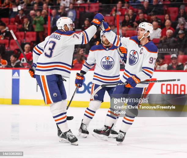 Connor McDavid of the Edmonton Oilers celebrates his first period goal against the Ottawa Senators with Vincent Desharnais at Canadian Tire Centre on...