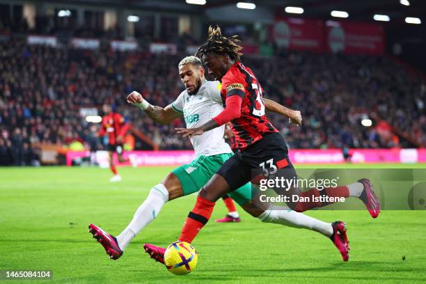 Jordan Zemura of AFC Bournemouth controls the ball whilst under pressure from Joelinton of Newcastle United during the Premier League match between...