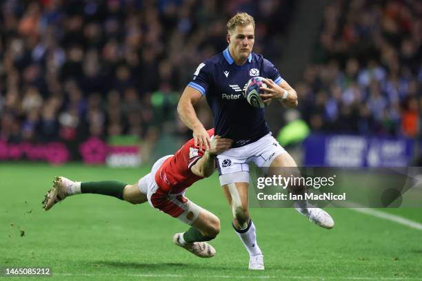 Kyle Steyn of Scotland is tackled by Liam Williamson of Wales during the Six Nations Rugby match between Scotland and Wales at Murrayfield Stadium on...