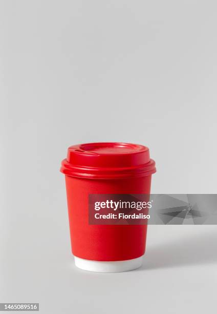 paper red hot drink cup with plastic lid on gray background - red mug stock pictures, royalty-free photos & images