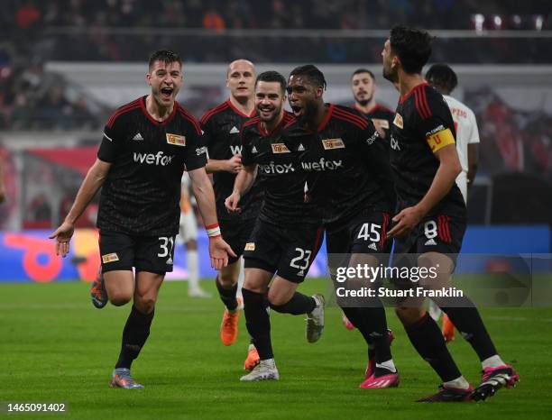 Robin Knoche of 1.FC Union Berlin celebrates with team mates after scoring their sides second goal from the penalty spot during the Bundesliga match...