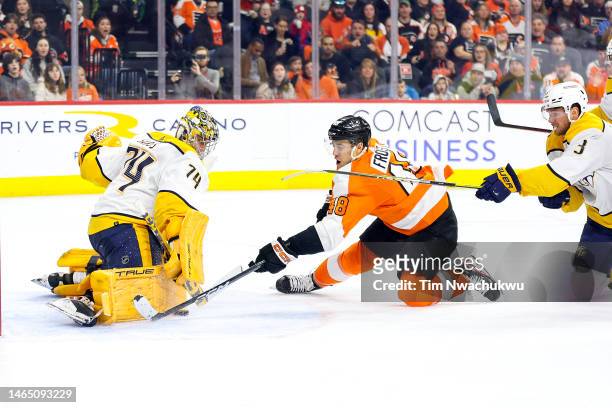 Juuse Saros of the Nashville Predators blocks a shot by Morgan Frost of the Philadelphia Flyers during the second period at Wells Fargo Center on...