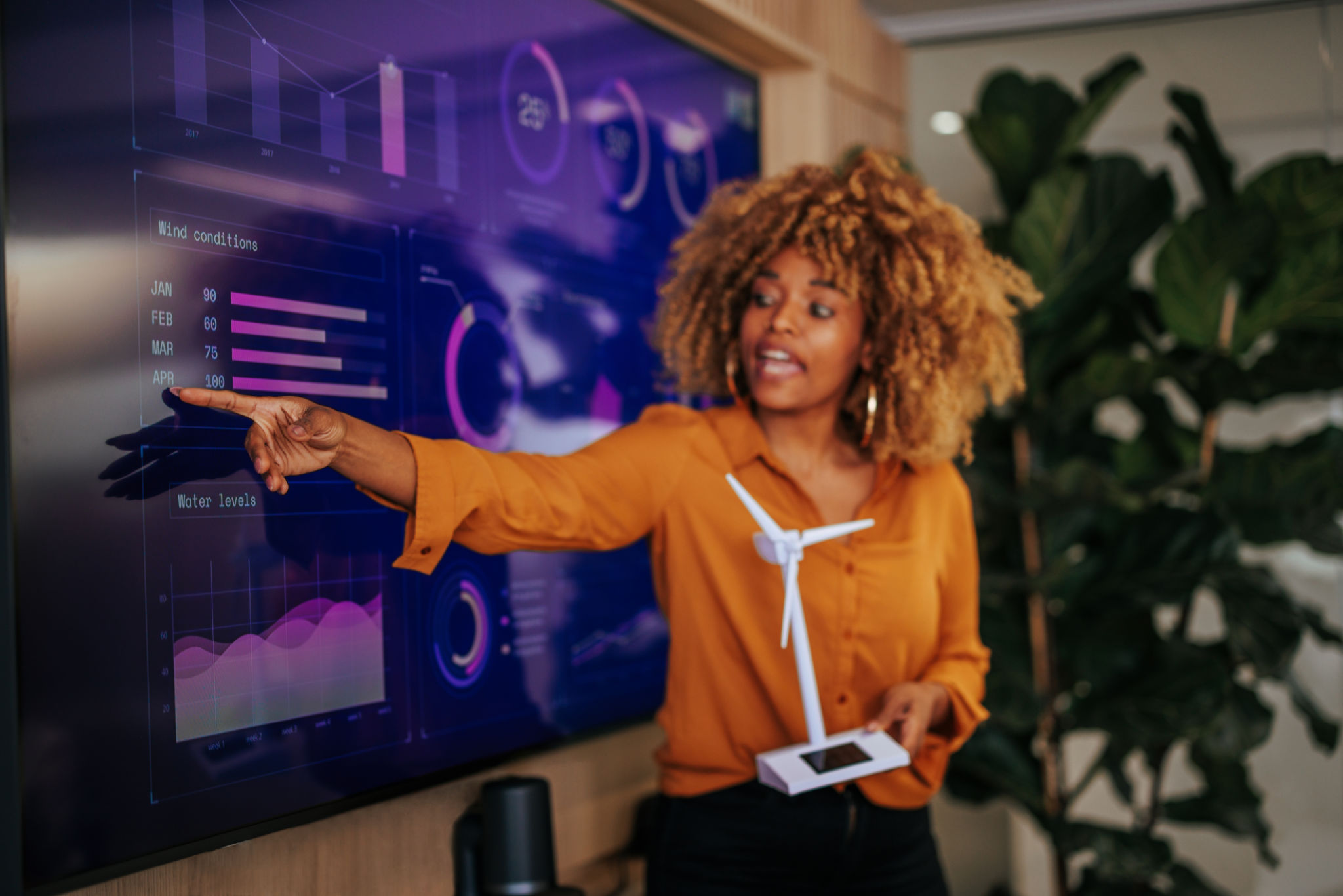 African American businesswoman presenting renewable energy sources. African American businesswoman presenting renewable energy sources.