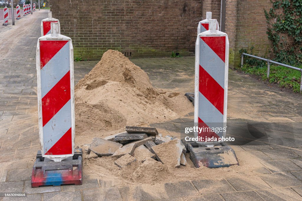 Vertical Traffic Warning Signs In A Concrete Block For Stability High ...