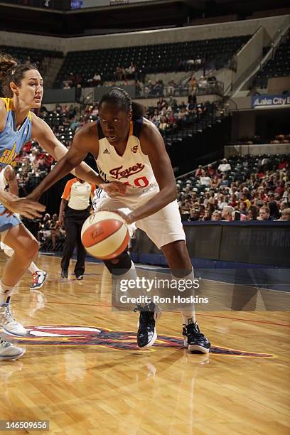 Jessica Davenport of the Indiana Fever handles the ball against Ruth Riley of the Chicago Sky at Banker Life Fieldhouse on June 16, 2012 in...