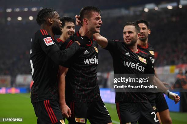 Robin Knoche of 1.FC Union Berlin celebrates with team mates after scoring their sides second goal from the penalty spot during the Bundesliga match...