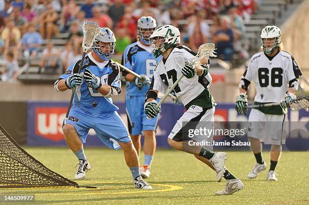 Ryan Young of the Long Island Lizards controls the ball as Marshall Burkhart of the Ohio Machine defends on June 16, 2012 at Selby Stadium in...