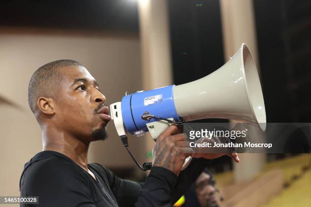 Presnel Kimpembe of PSG addresses the fans using a megaphone following the 3-1 defeat in the Ligue 1 match between AS Monaco and Paris Saint-Germain...