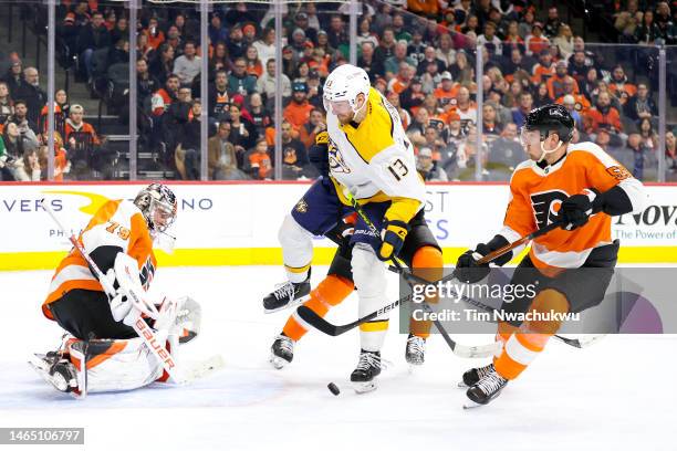 Yakov Trenin of the Nashville Predators attempts a shot past Rasmus Ristolainen of the Philadelphia Flyers during the first period at Wells Fargo...