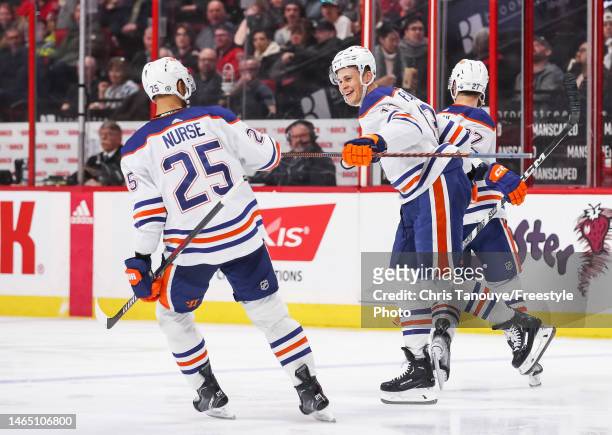 Jesse Puljujarvi of the Edmonton Oilers celebrates his third period goal against the Ottawa Senators with Darnell Nurse at Canadian Tire Centre on...