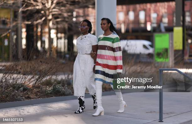 The Yusufs seen wearing sunglasses, gold earrings, a gold pendants necklace, Kate Spade white cut-out print pattern short sleeves cropped top,...