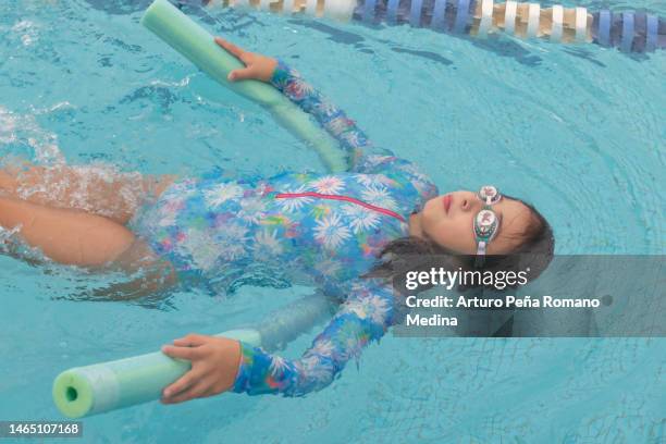 Tween Floating Inpool Tween Girl Swimming Pool Photos and Premium High Res Pictures - Getty ...