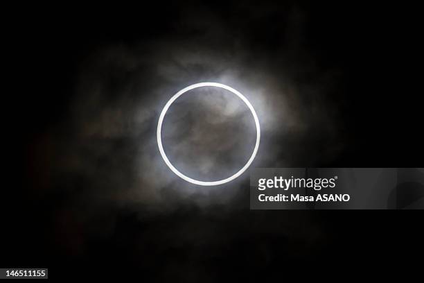 an annular eclipse in tokyo - annular solar eclipse stock pictures, royalty-free photos & images