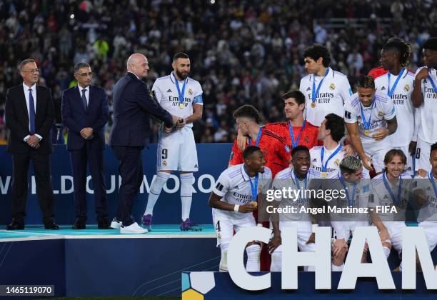 Gianni Infantino, President of FIFA hands the FIFA Club World Cup Morocco 2022 Trophy to Karim Benzema of Real Madrid after the FIFA Club World Cup...