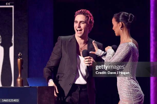 Carlos O'Connell of Fontaines D.C. Receives the international group of the year award from Maya Jama on stage during The BRIT Awards 2023 at The O2...