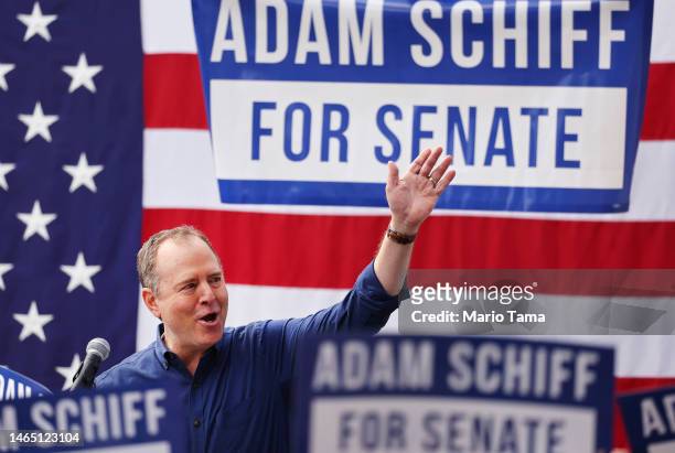 Rep. Adam Schiff waves to supporters outside the International Alliance of Theatrical Stage Employees Union Hall, at the kickoff rally for his...