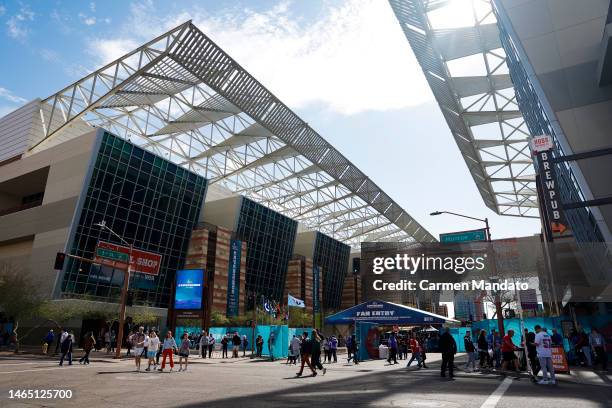 Fans walk around downtown Phoenix, outside of the fan experience, ahead of Super Bowl LVII on February 11, 2023 in Phoenix, Arizona.