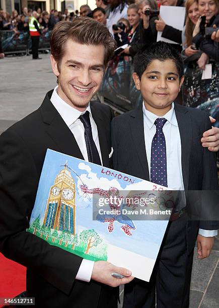 Actor Andrew Garfield meets young fan Uzayr Haider at the UK Premiere of 'The Amazing Spider-Man' at Odeon Leicester Square on June 18, 2012 in...