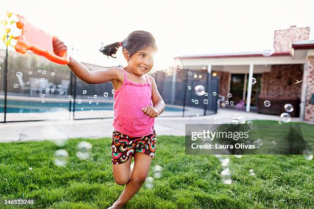 girl and bubble machine - the bubble machine stock pictures, royalty-free photos & images