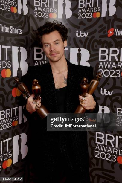 Harry Styles poses with his awards in the media room during The BRIT Awards 2023 at The O2 Arena on February 11, 2023 in London, England.