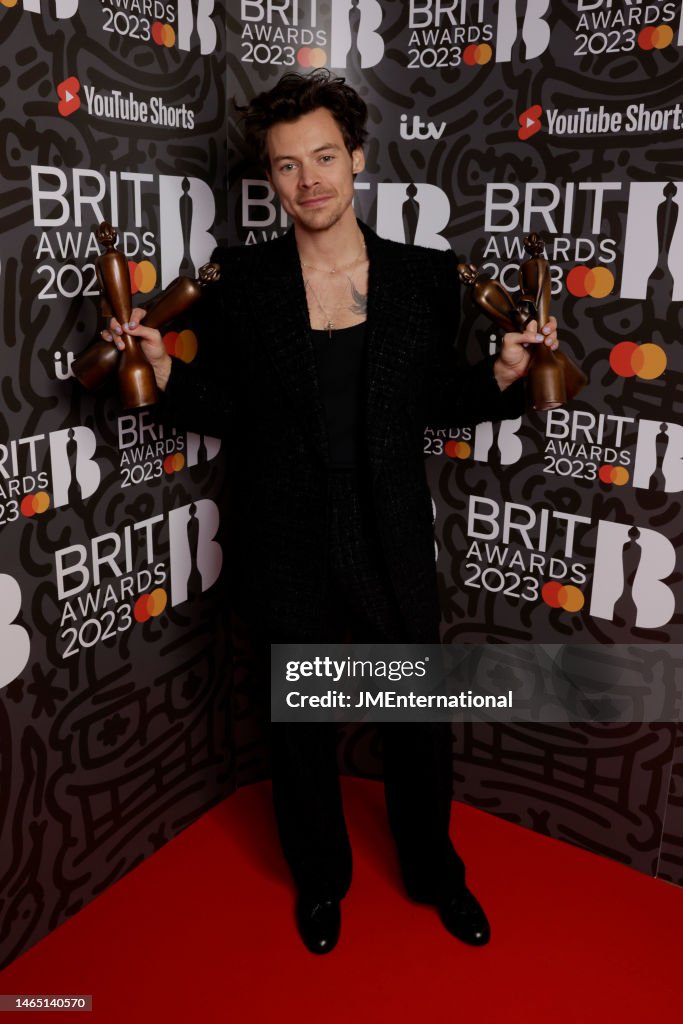 editorial-use-only-harry-styles-poses-with-his-awards-in-the-media-room-during-the-brit-awards.jpg
