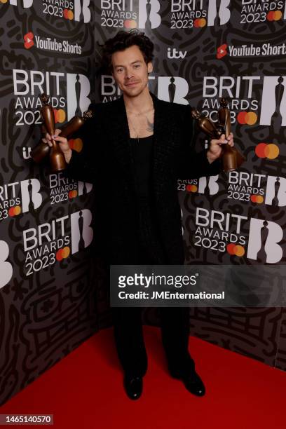 Harry Styles poses with his awards in the media room during The BRIT Awards 2023 at The O2 Arena on February 11, 2023 in London, England.