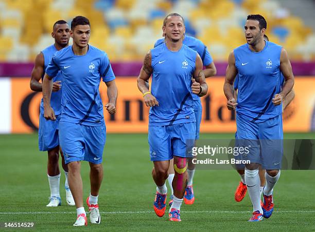 Hatem Ben Arfa, Philippe Mexes and Adil Rami of France warm up during a UEFA EURO 2012 training session at the Olympic Stadium on June 19, 2012 in...