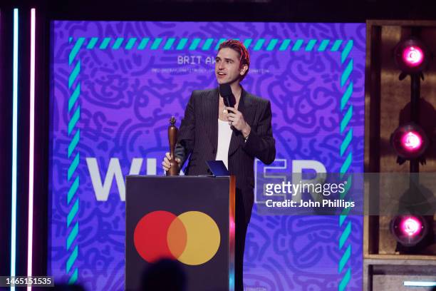 Carlos accepts the award for best International Group on behalf of Fontaines D.C on stage during The BRIT Awards 2023 at The O2 Arena on February 11,...