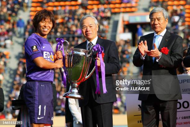 Captain Hisato Sato of Sanfrecce Hiroshima receives the trophy at the award ceremony following the Fuji Xerox Super Cup between Sanfrecce Hiroshima...