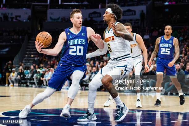 Gordon Hayward of the Charlotte Hornets drives to the basket while guarded by Kentavious Caldwell-Pope of the Denver Nuggets in the first quarter...