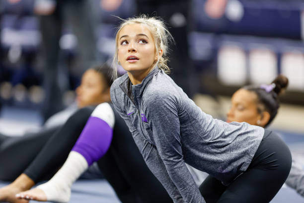 Olivia Dunne of LSU stretches before a meet against Auburn at Neville Arena on February 10, 2023 in Auburn, Alabama.