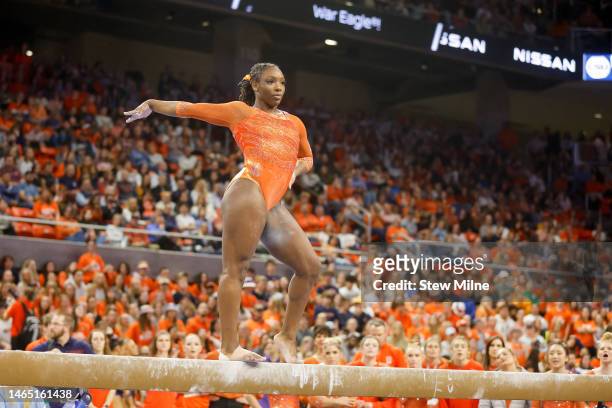 Aria Brusch of Auburn competes on the balance beam during a meet against LSU at Neville Arena on February 10, 2023 in Auburn, Alabama.