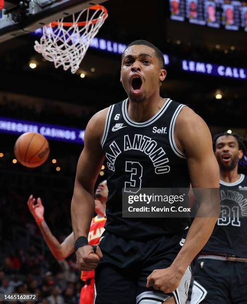 Keldon Johnson of the San Antonio Spurs reacts after a basket and a foul against John Collins of the Atlanta Hawks during the second quarter at State...