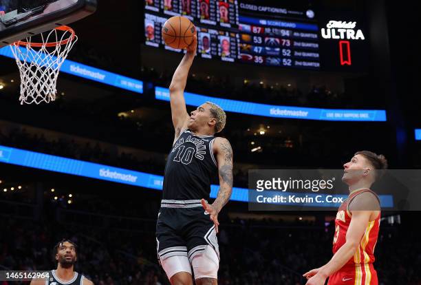 Jeremy Sochan of the San Antonio Spurs dunks against the Atlanta Hawks during the first quarter at State Farm Arena on February 11, 2023 in Atlanta,...