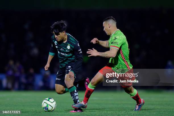 Diego Medina of Santos fights for the ball with Jesus Duenas of Juarez during the 6th round match between FC Juarez and Santos Laguna as part of the...