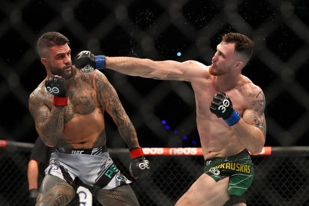 Modestas Bukauskas of Lithuania punches Tyson Pedro of Australia in a light heavyweight fight during UFC 284 at RAC Arena on February 12, 2023 in...