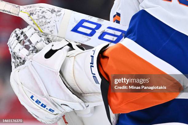 Closeup view of the Bauer goalie stick and True Temper goalie glove of Semyon Varlamov of the New York Islanders during the second period against the...