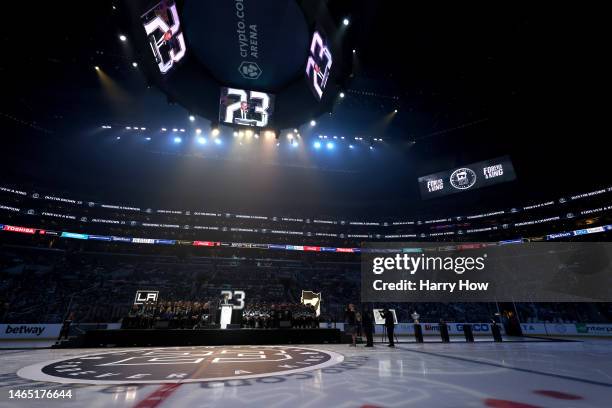 Dustin Brown of the Los Angeles Kings speaks during a ceremony as his jersey number is retired and a statue of his likeliness is unveiled at the...