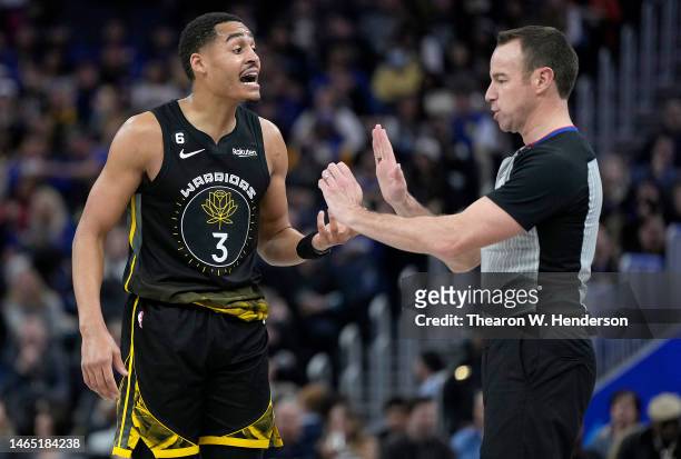 Jordan Poole of the Golden State Warriors complains to official Josh Tivens after Tivens called a foul on Poole against the Los Angeles Lakers during...