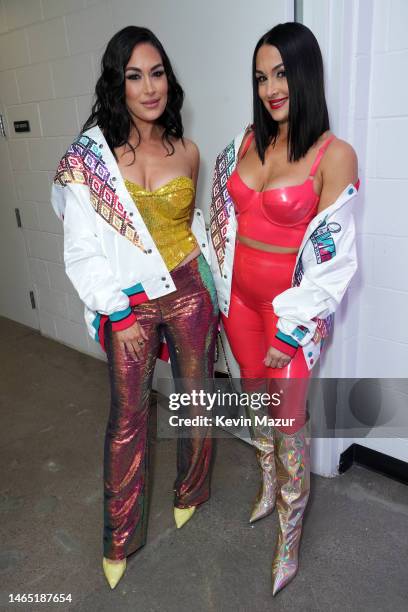 Brie Bella and Nikki Bella attend onstage during the Bud Light Super Bowl Music Festival at Footprint Center on February 11, 2023 in Phoenix, Arizona.