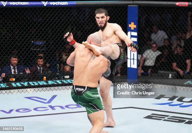 Islam Makhachev of Russia kicks Alexander Volkanovski of Australia in the UFC lightweight championship fight during the UFC 284 event at RAC Arena on...