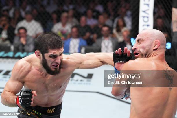 Islam Makhachev of Russia punches Alexander Volkanovski of Australia in the UFC lightweight championship fight during the UFC 284 event at RAC Arena...